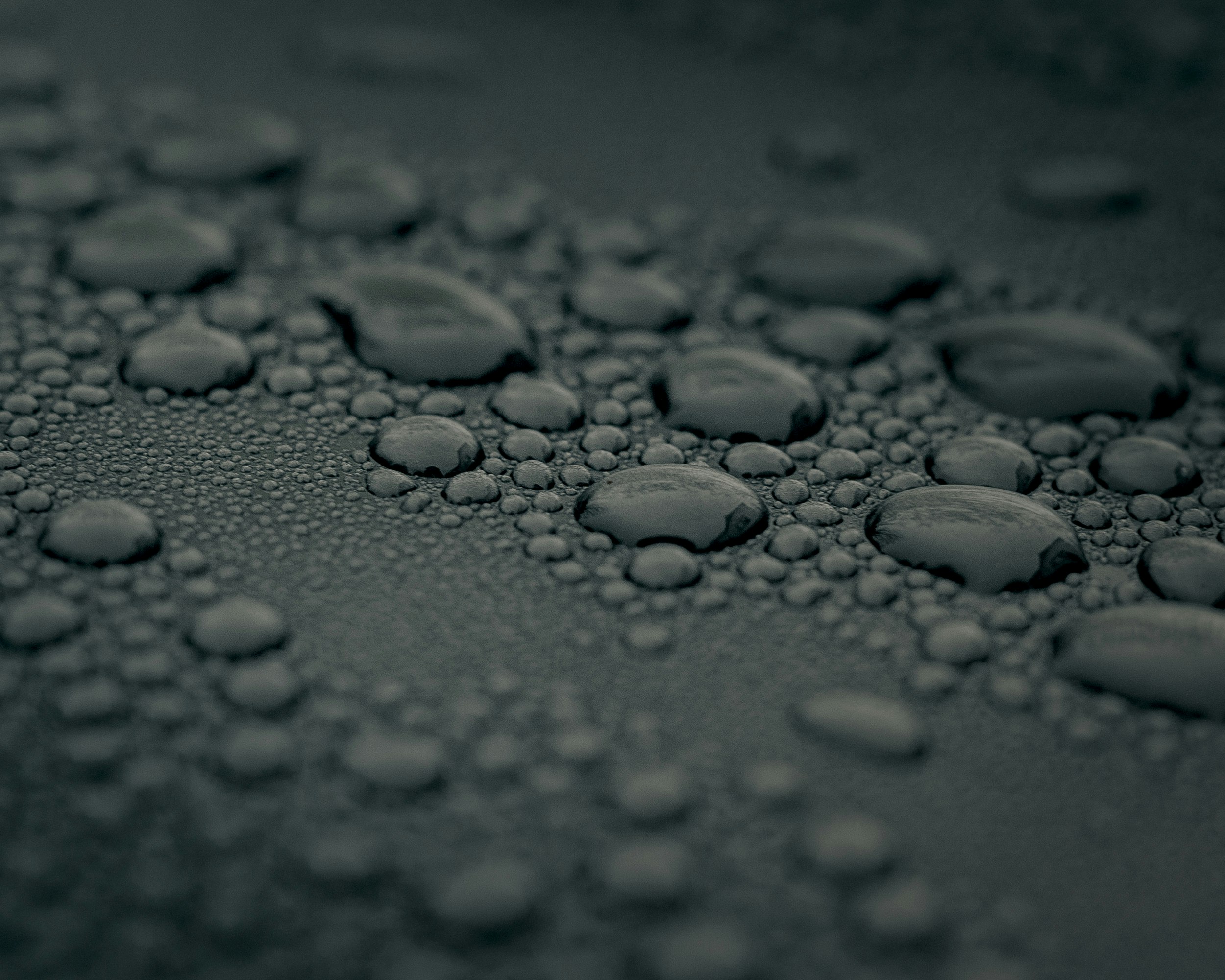 water droplets on gray surface